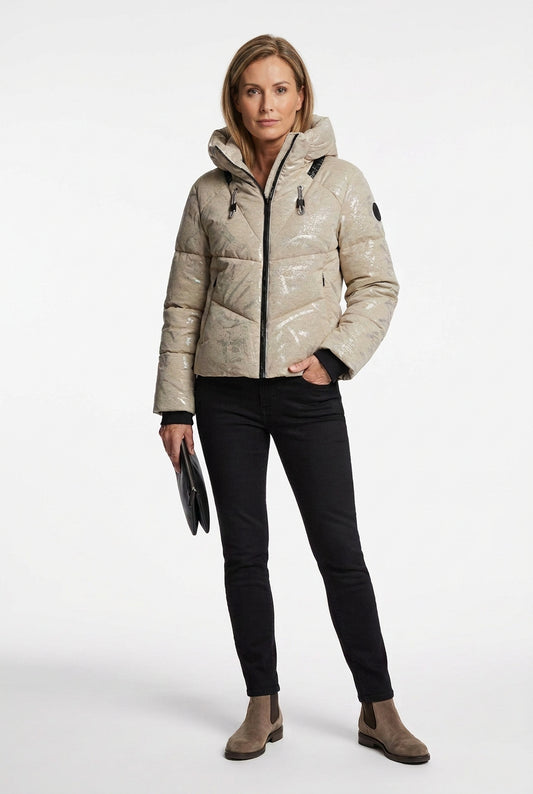 A light beige puffer jacket with a subtle metallic sheen, featuring a black front zipper, black drawstrings, and black ribbed cuffs, shown against a plain white background.